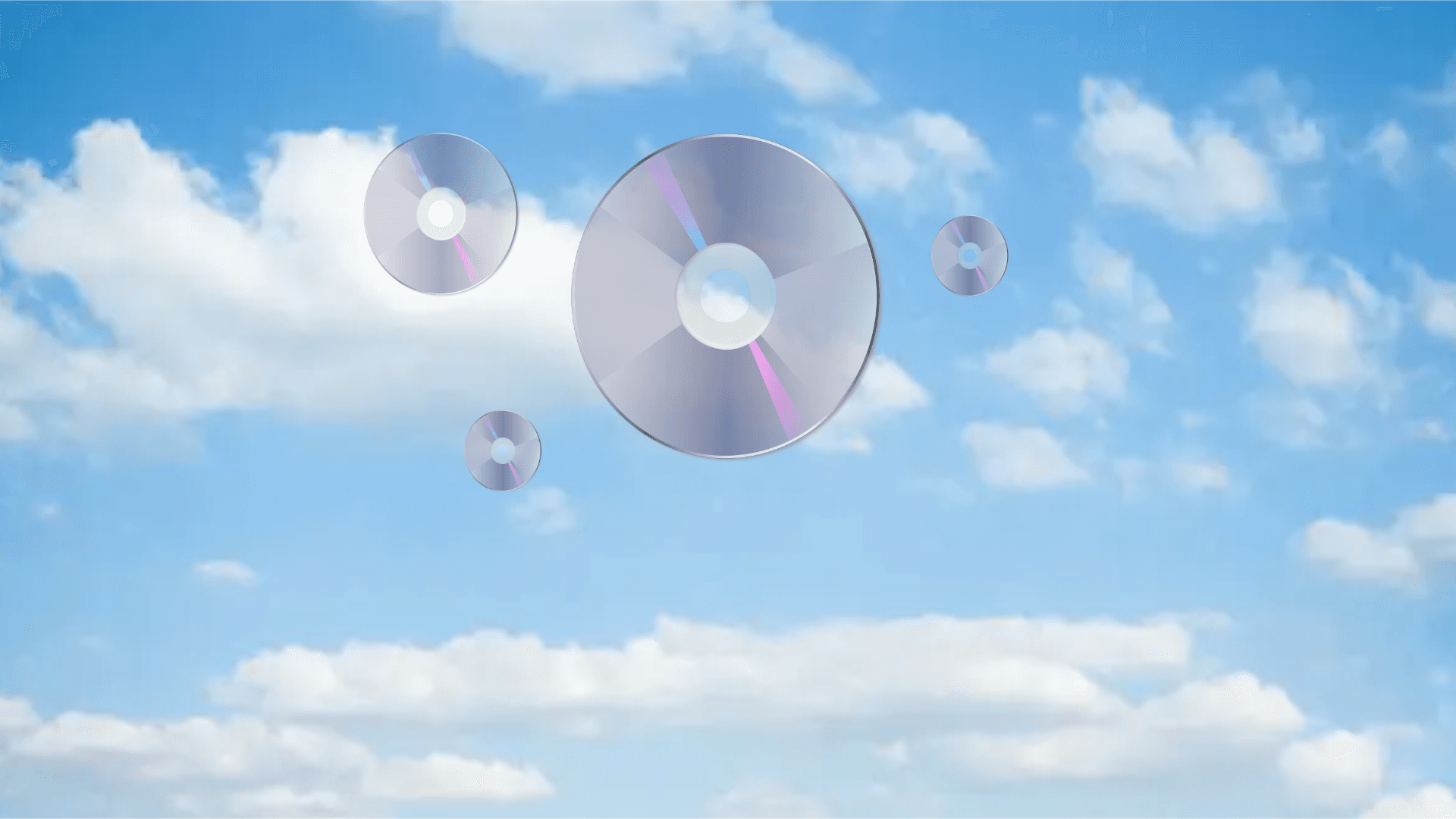An image of clouds with DVDs floating in the air.